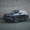 Stylish Infiniti QX60 SUV parked in an urban setting, showcasing modern automotive design.