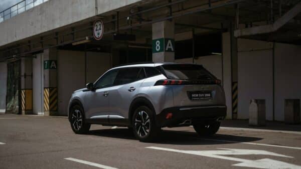 a silver car parked in front of a building