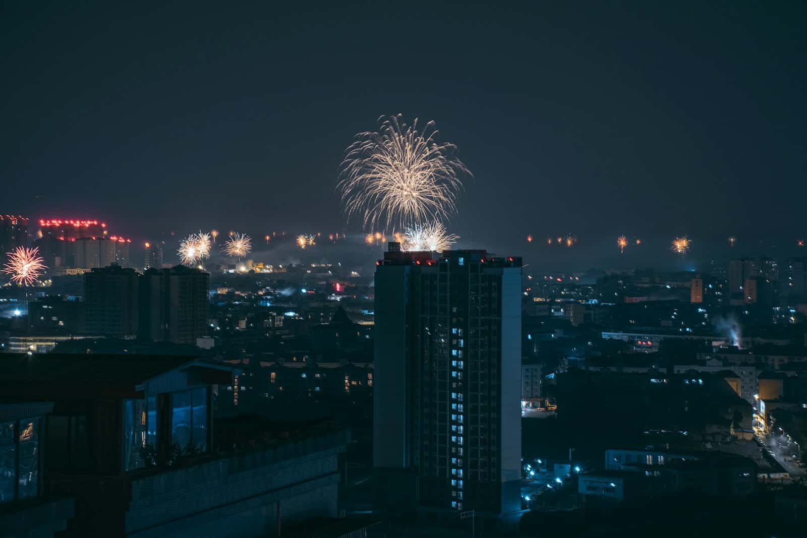 fireworks display above buildings