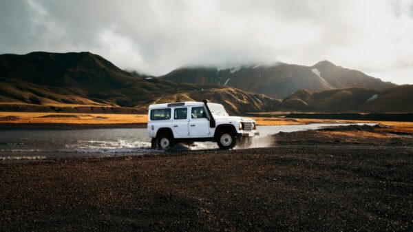 white car crossing body of water