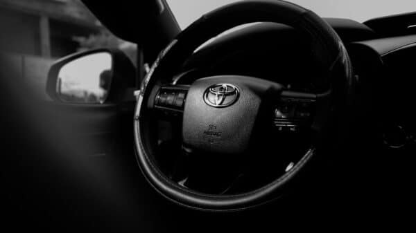 Close-up of a toyota steering wheel inside a car