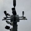 a traffic light with multiple cameras attached to it