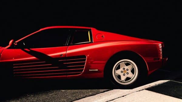 a red sports car parked on the side of the road