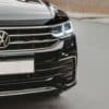 a close up of the front of a black volkswagen suv