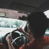 man driving car