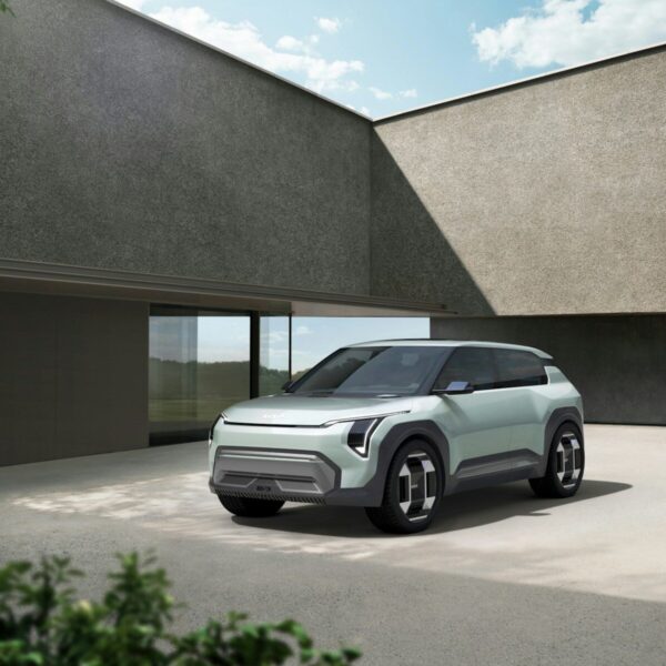 a small car parked in front of a building