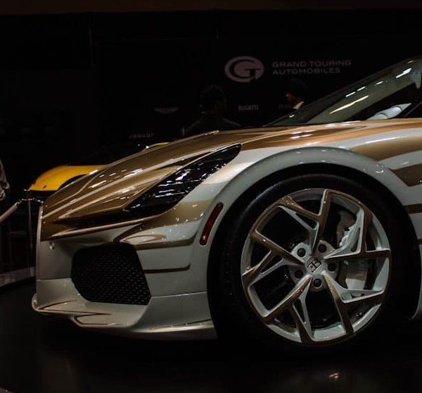 A custom sports car with unique gold accents on display