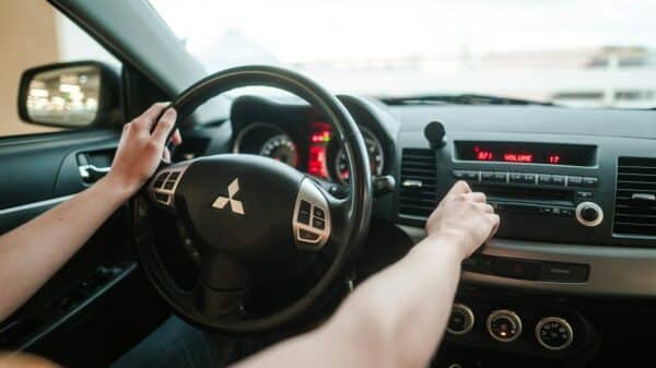 person driving car during daytime