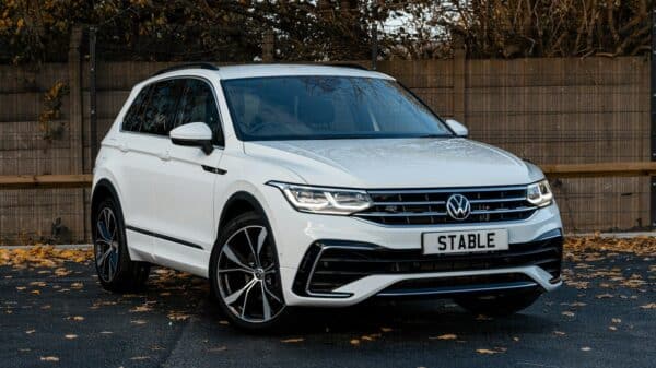 a white car parked in a driveway