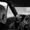 Man driving a car on a blurry day