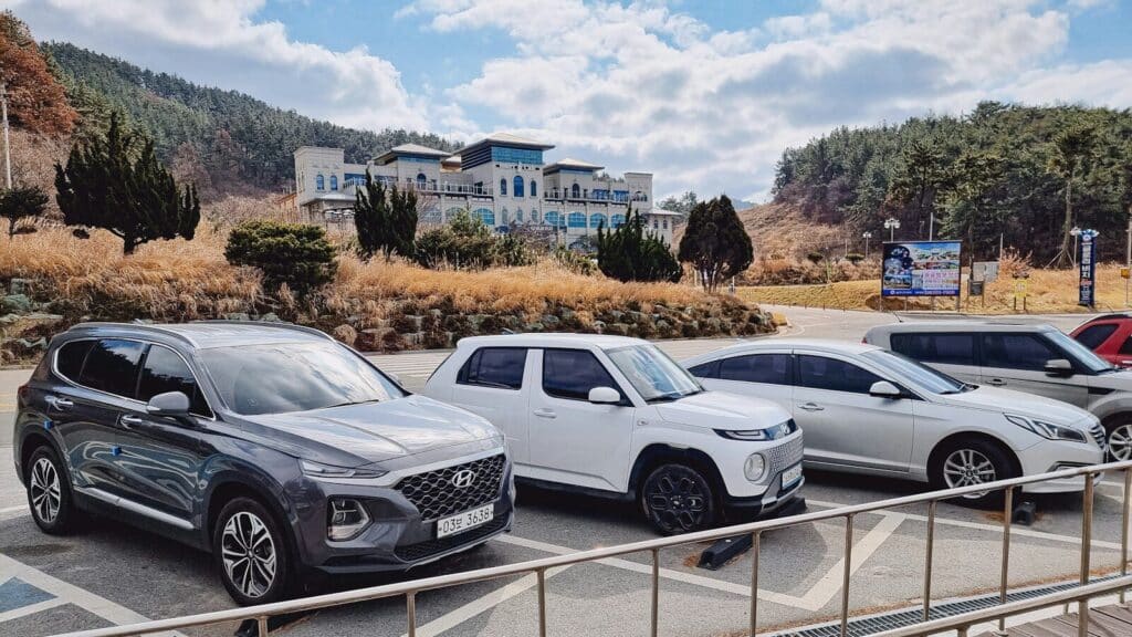 a group of cars parked in a parking lot