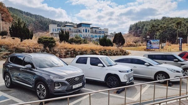a group of cars parked in a parking lot