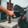 person holding black corded device