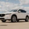 a white mazda cx - 5 parked in a parking lot
