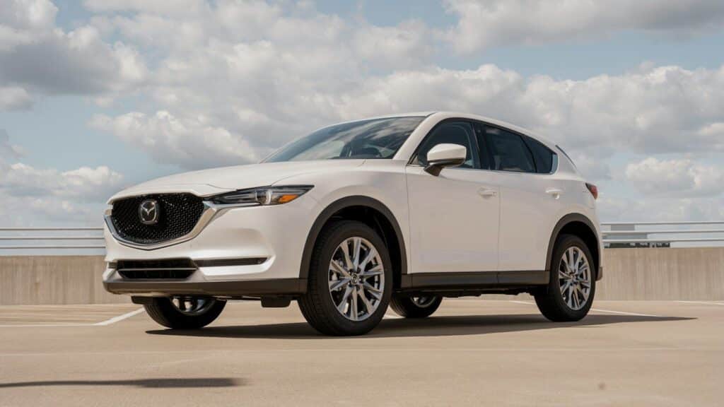 a white mazda cx - 5 parked in a parking lot