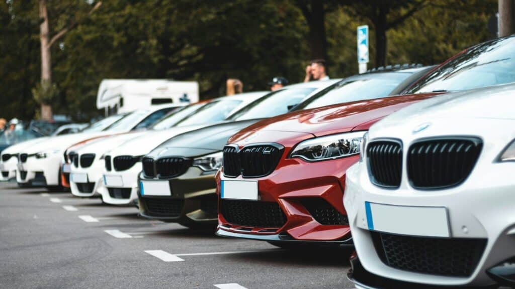 white and red bmw m 3 on road during daytime