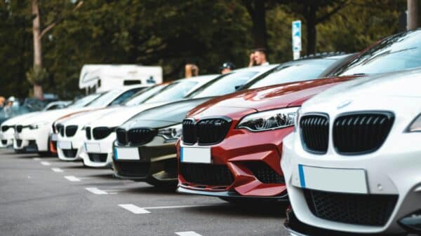 white and red bmw m 3 on road during daytime