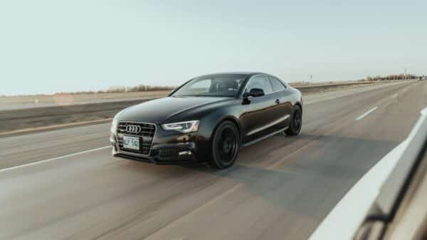 black audi sedan on road during daytime