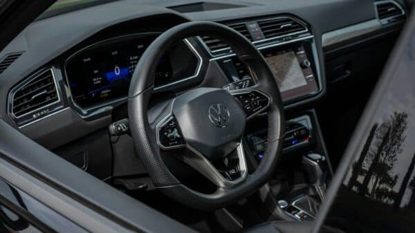 Modern car interior with digital dashboard and steering wheel.