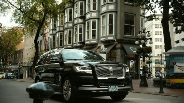 a black car parked on the side of the road