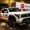 White toyota trd truck with colorful graphics on display