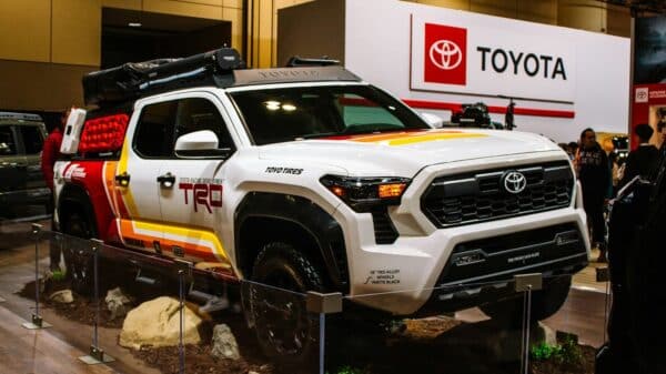 White toyota trd truck with colorful graphics on display