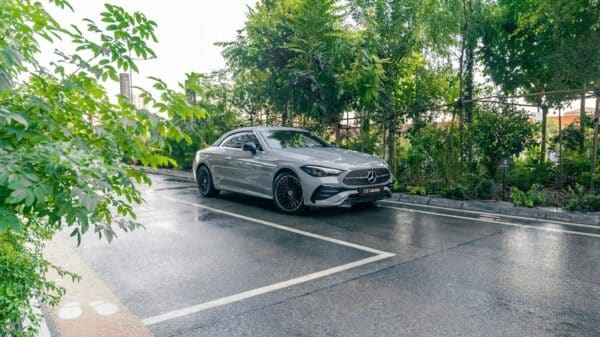 A silver car parked on a wet road