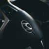 selective focus of black Hyundai steering wheel