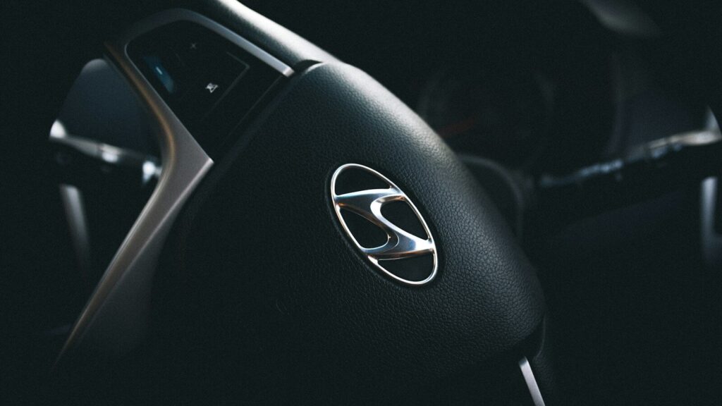 selective focus of black Hyundai steering wheel