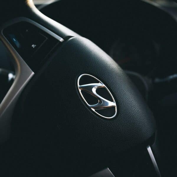 selective focus of black Hyundai steering wheel