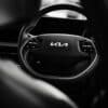 a black and white photo of a car steering wheel
