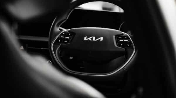 a black and white photo of a car steering wheel
