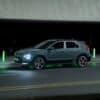 a car driving down a street at night
