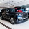 Dark blue luxury suv with red bow on hood