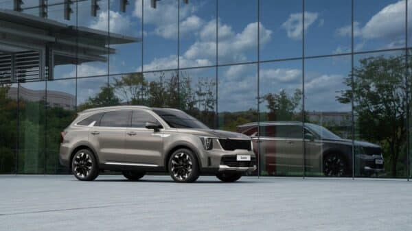 a silver car parked in front of a building