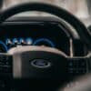 a close up of the steering wheel of a car