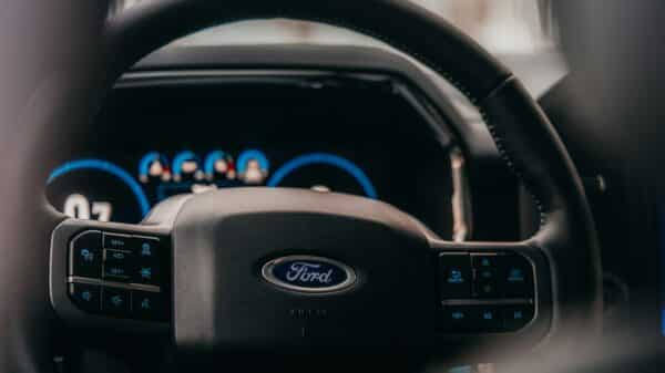 a close up of the steering wheel of a car
