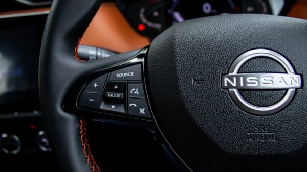 Close-up of a nissan steering wheel with controls