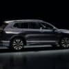 Dark blue suv parked on a reflective surface